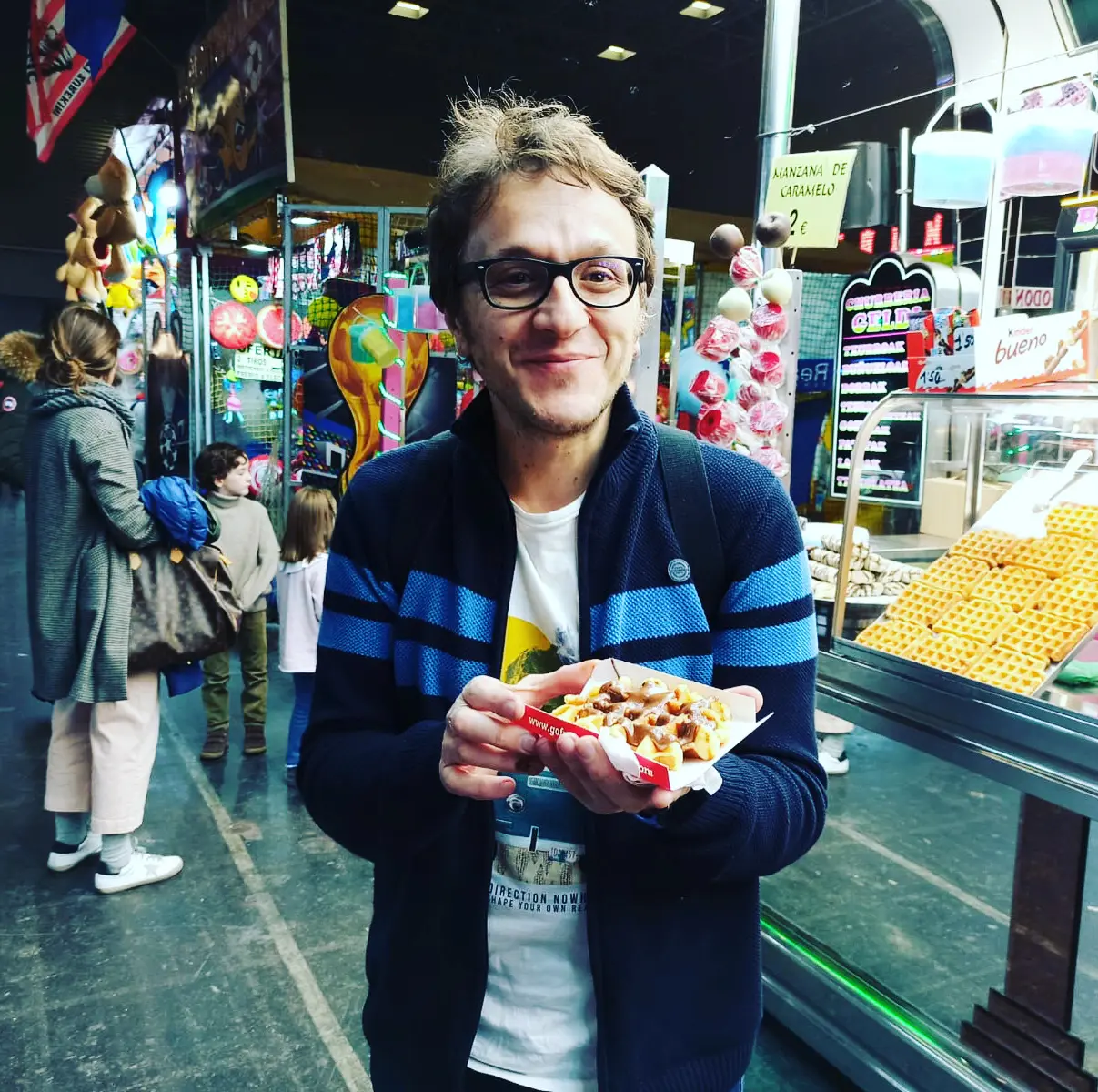 Alessandro holding a waffle